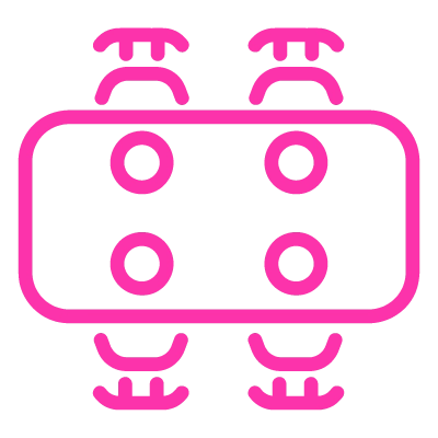 A pink outline of a dining table set for four guests.